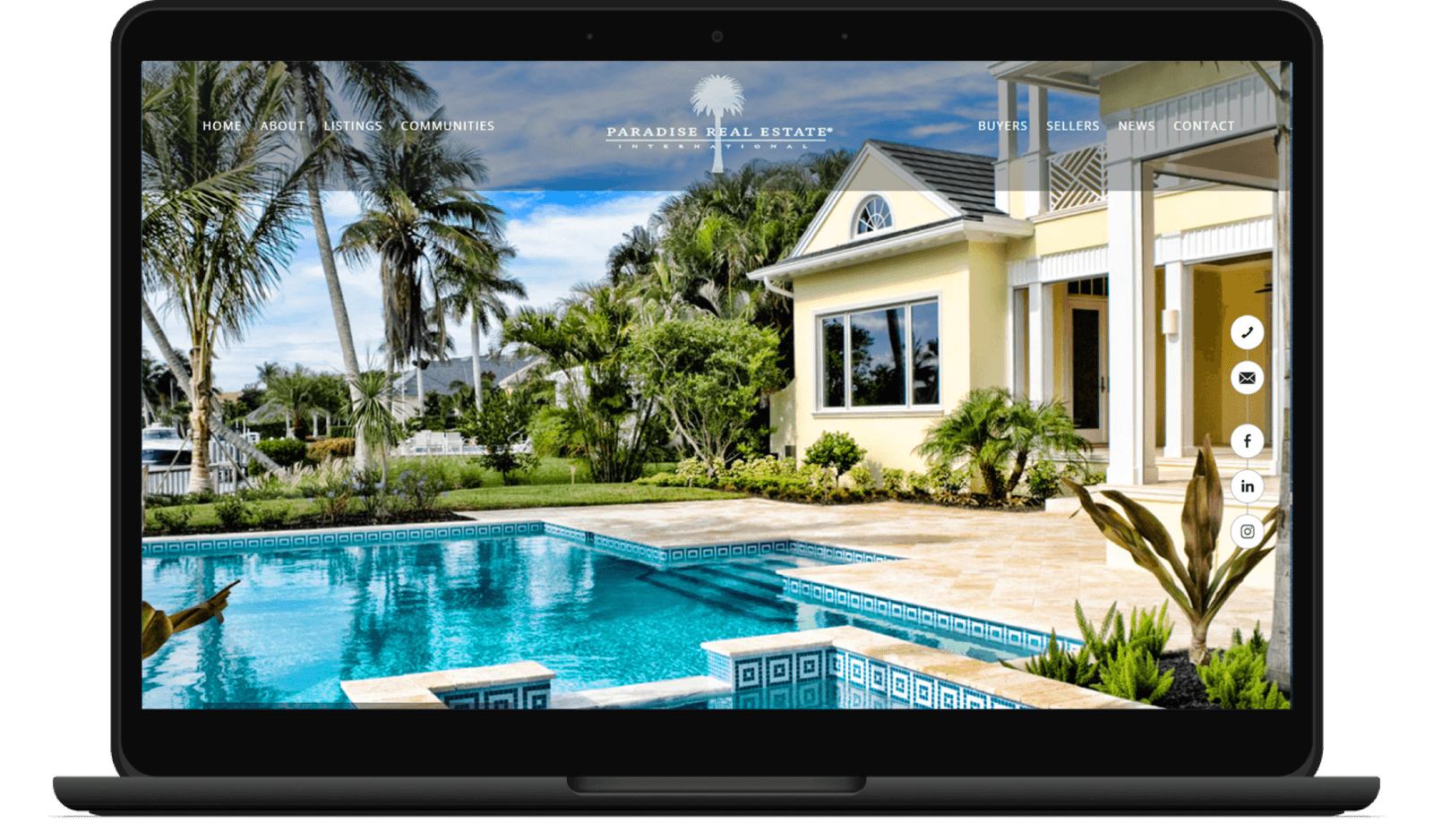 Paradise Real Estate International screenshot on laptop