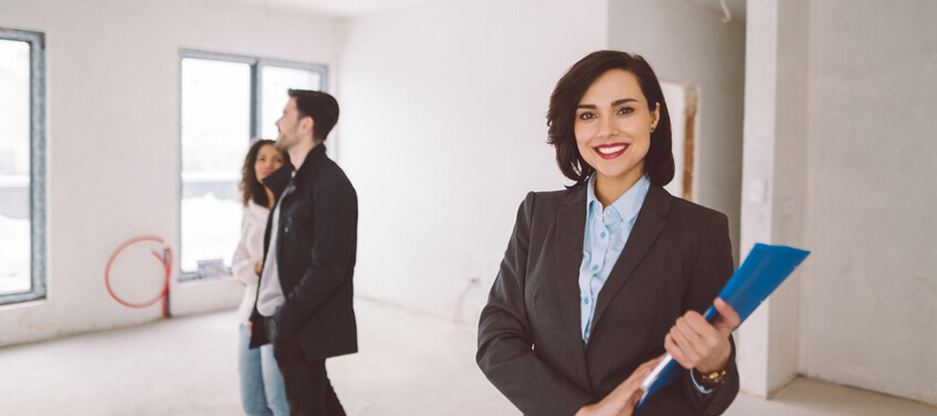 A seller’s agent showing a new home to a couple