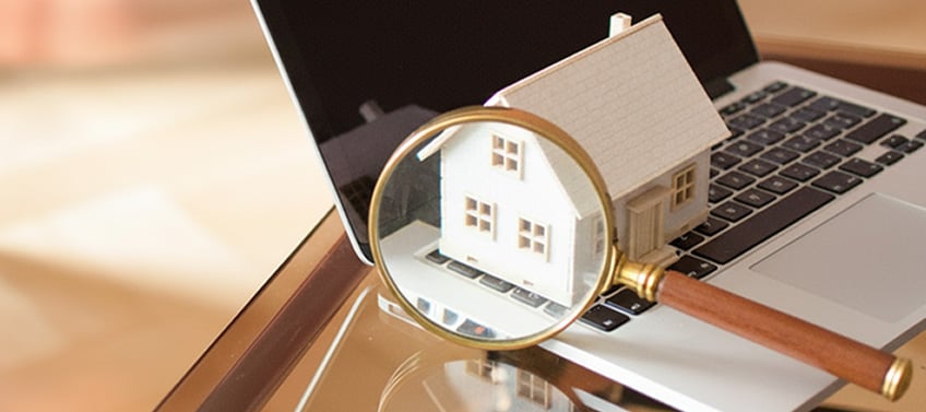 Photo of magnifying glass on laptop